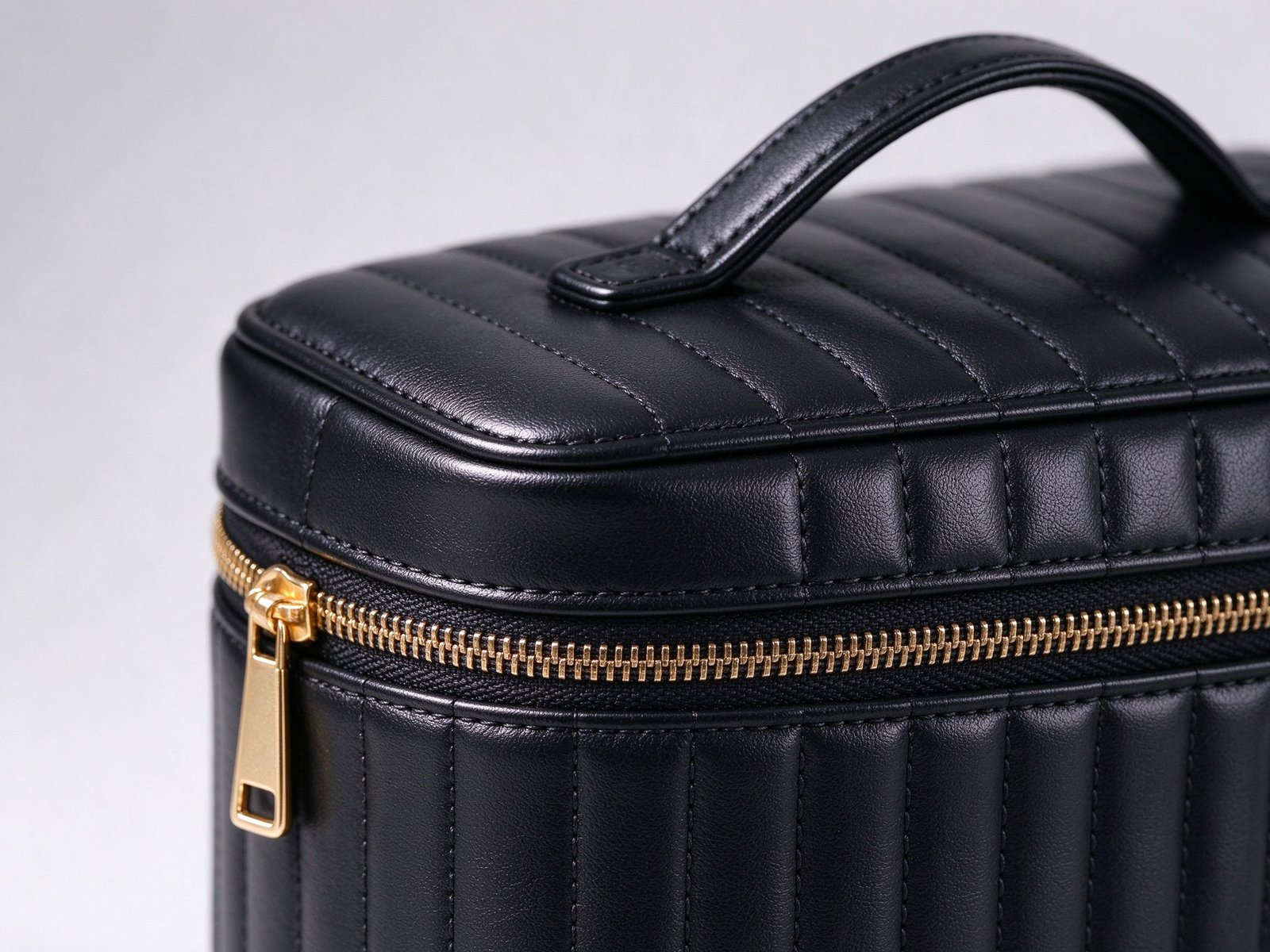 Close-up of quilted PU leather and gold zip on a wholesale makeup brush bag
